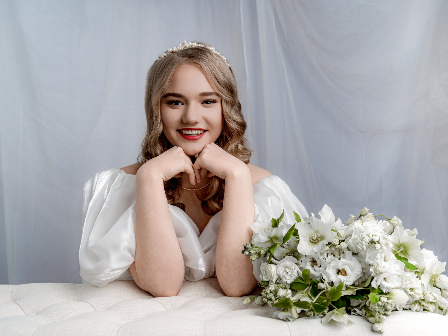 Bride wearing cascade pearl tiara in classic wedding dress